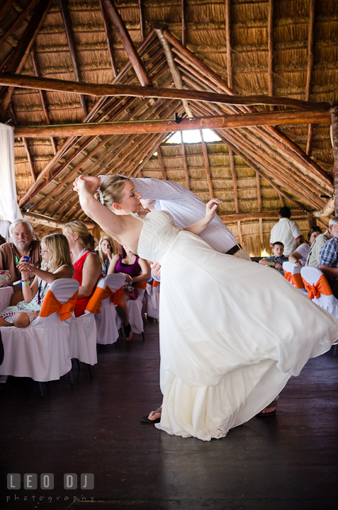 Action during first dance. Carnival Cruise ship destination wedding reception photos of Jessica and Chad, Cozumel Mexico by photographers of Leo Dj Photography.