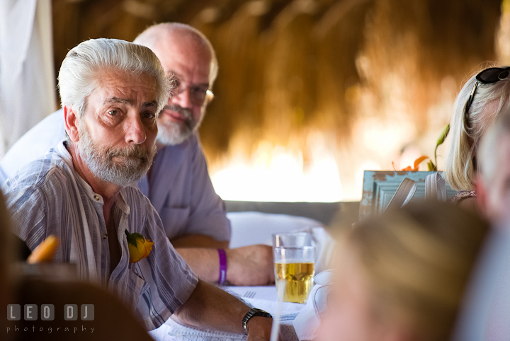 Groom's father emotional watching Mother Son dance. Carnival Cruise ship destination wedding reception photos of Jessica and Chad, Cozumel Mexico by photographers of Leo Dj Photography.
