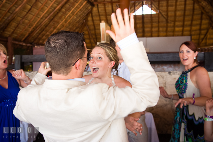 Bride, Groom and guests having fun dancing. Carnival Cruise ship destination wedding reception photos of Jessica and Chad, Cozumel Mexico by photographers of Leo Dj Photography.