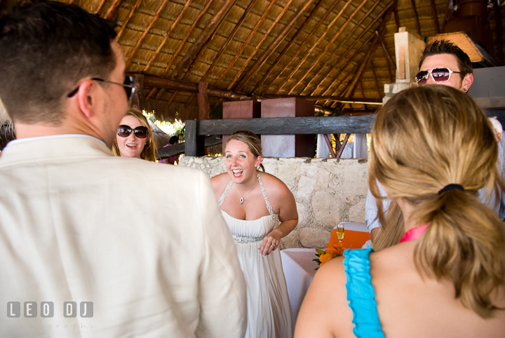 Bride laughing with Groom and guests during dancing. Carnival Cruise ship destination wedding reception photos of Jessica and Chad, Cozumel Mexico by photographers of Leo Dj Photography.