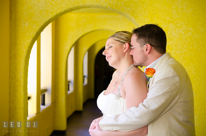 Bride and Groom cuddled in the hotel hallway. Carnival Cruise ship destination wedding reception photos of Jessica and Chad, Cozumel Mexico by photographers of Leo Dj Photography.