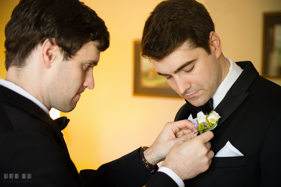 Kent Manor Inn wedding best man helping groom put boutonniere photo by Leo Dj Photography