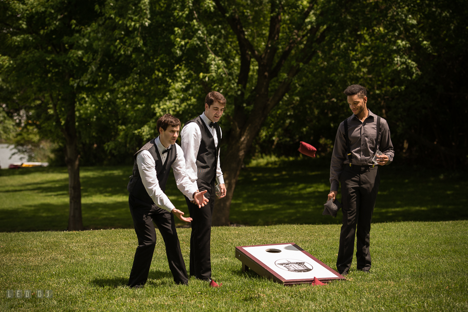 Eastern Shore Maryland Groom and guests playing corn hole photo by Leo Dj Photography