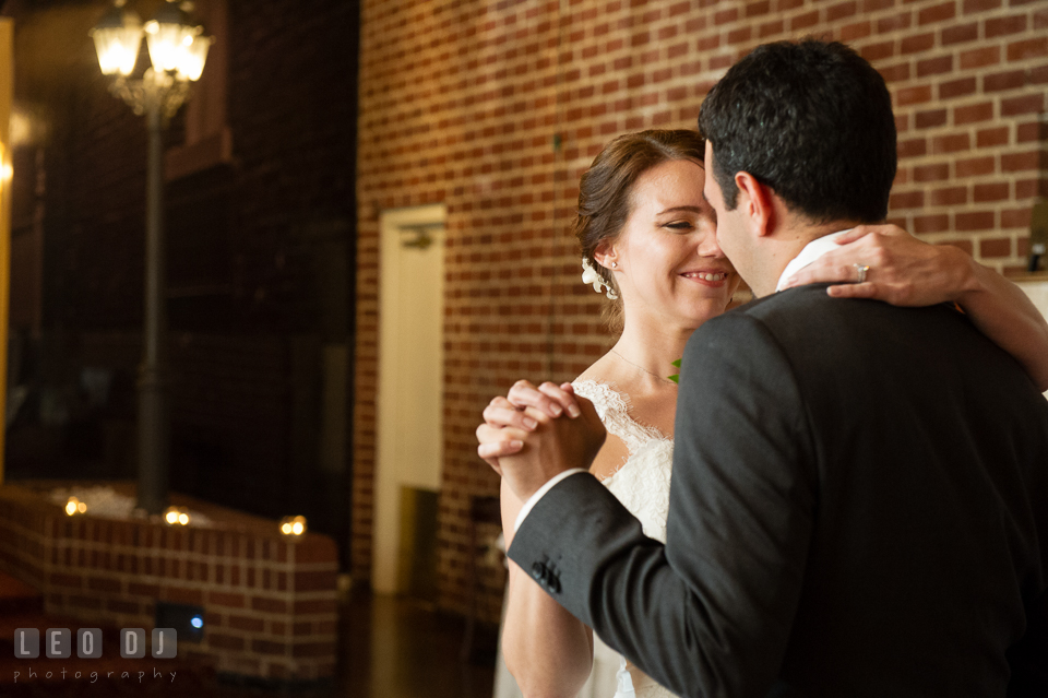 Bride's lovely smile during first dance with Groom. Historic Inns of Annapolis Maryland, Governor Calvert House Greek wedding, by wedding photographers of Leo Dj Photography. http://leodjphoto.com