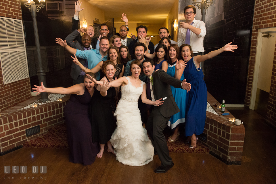 Bride and Groom with their friends and families posing for the picture. Historic Inns of Annapolis Maryland, Governor Calvert House Greek wedding, by wedding photographers of Leo Dj Photography. http://leodjphoto.com