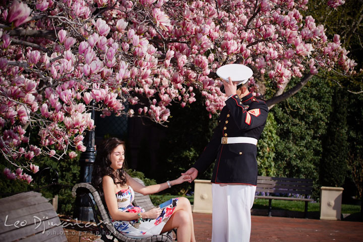 Engaged Marine officer in military uniform holding his fiancée and took off hat. Pre wedding engagement photo Washington DC Smithsonians museum and Ronald Reagan Washington National Airport DCA, by wedding photographer Leo Dj Photography