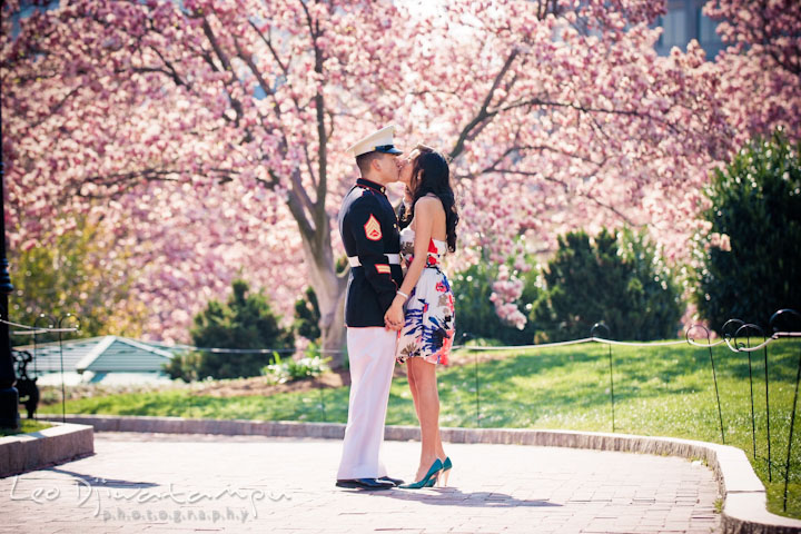 Engaged girl kissed her fiancé, a Marine officer in military uniform. Washington Monument in the background. Pre wedding engagement photo Washington DC Smithsonians museum and Ronald Reagan Washington National Airport DCA, by wedding photographer Leo Dj Photography