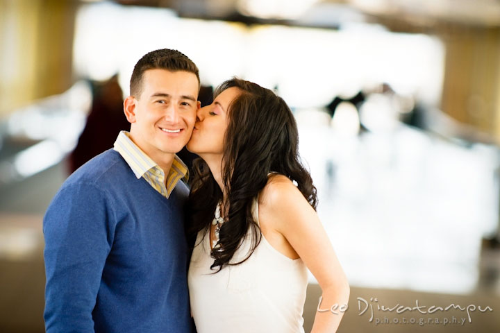 Engaged girl kissed her fiancé's cheek. Pre wedding engagement photo Washington DC Smithsonians museum and Ronald Reagan Washington National Airport DCA, by wedding photographer Leo Dj Photography