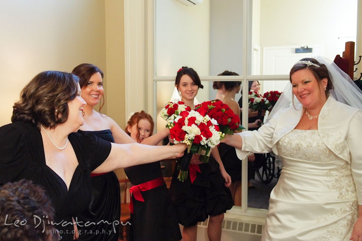Bride, maid of honor and bridesmaids uniting their bouquets. Prospect Bay Country Club Grasonville MD Wedding Photographer by Leo Dj Photography