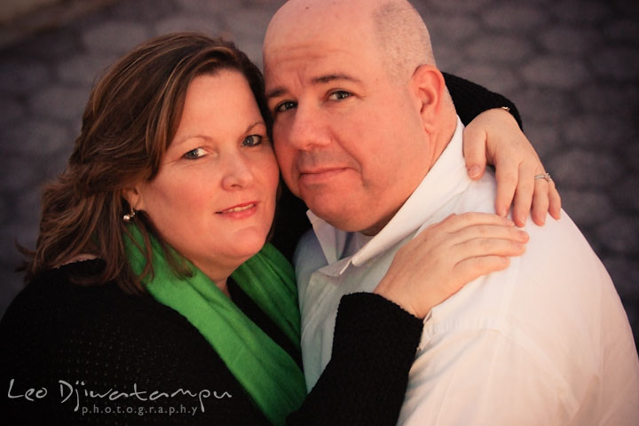 Engaged couple hugging and posing for the camera. Annapolis Downtown USNA Pre-wedding Engagement Photographer, Leo Dj Photography