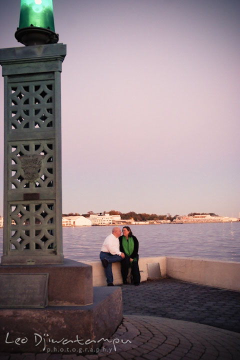 Fiancé and his fiancé sitting at a corner at the Naval Academy. Annapolis Downtown USNA Pre-wedding Engagement Photographer, Leo Dj Photography