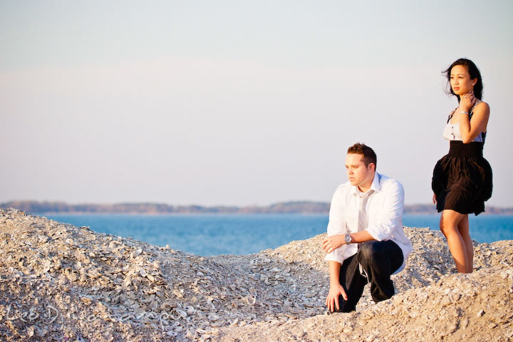 engaged couple posing like models. Romantic engagement session on beach Kent Island Maryland