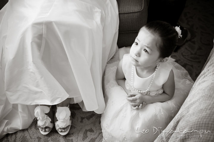 Cute flower girl posing, sitting by bride's feet. Falls Church Virginia 2941 Restaurant Wedding Photography