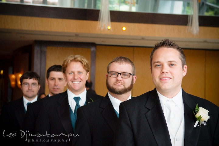 Groom, best man, and groomsmen posing, standing in line. Falls Church Virginia 2941 Restaurant Wedding Photography