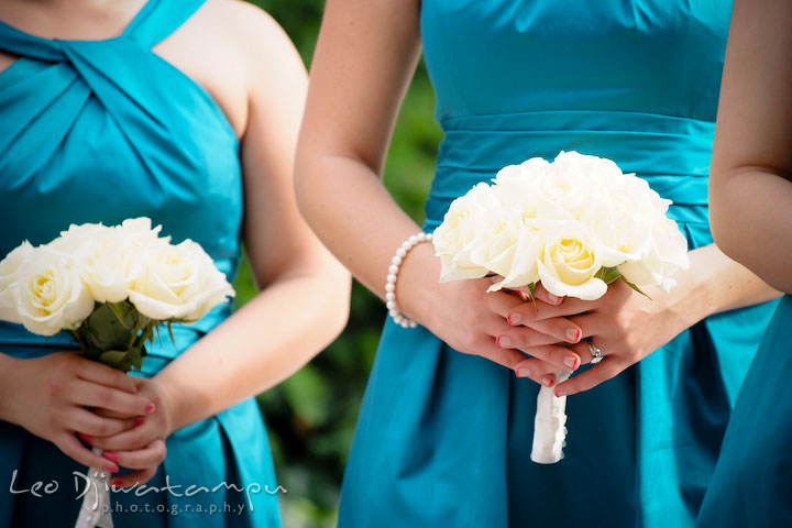 White roses flower bouquet being held by maid of honor and bridesmaids. Falls Church Virginia 2941 Restaurant Wedding Photography