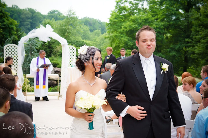 Groom making funny expression, brides smiles. Falls Church Virginia 2941 Restaurant Wedding Photography