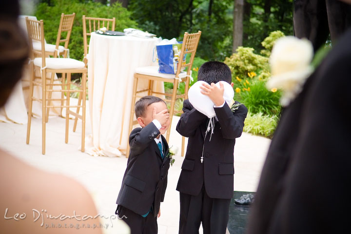 Ring bearer boys closed their eyes, not wanting to look at bride and groom kissing. Falls Church Virginia 2941 Restaurant Wedding Photography