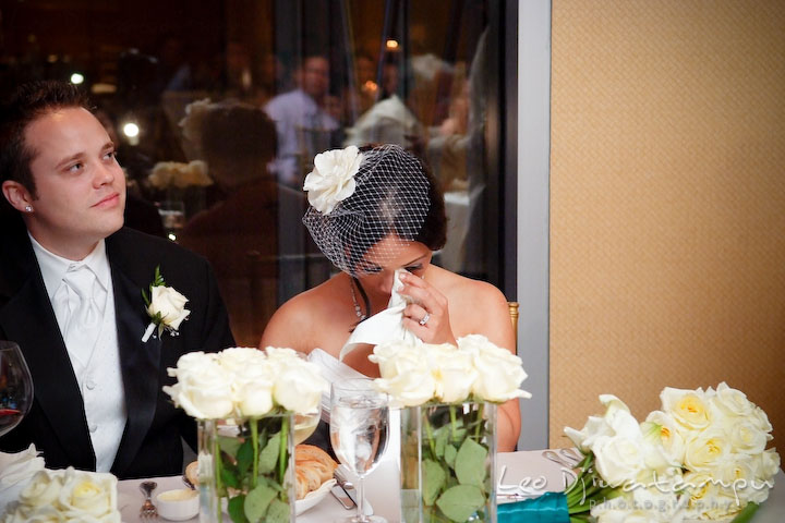 Bride shed tear listening to father of the bride's speech. Falls Church Virginia 2941 Restaurant Wedding Photographer