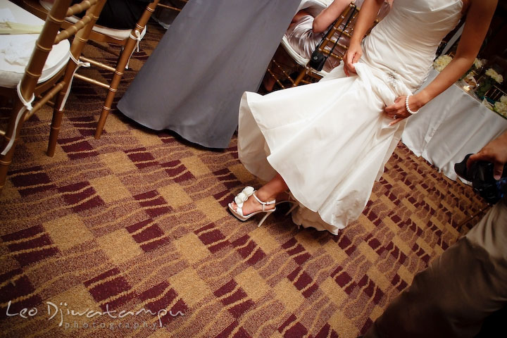 Bride showing off her beautiful wedding shoes. Falls Church Virginia 2941 Restaurant Wedding Photographer