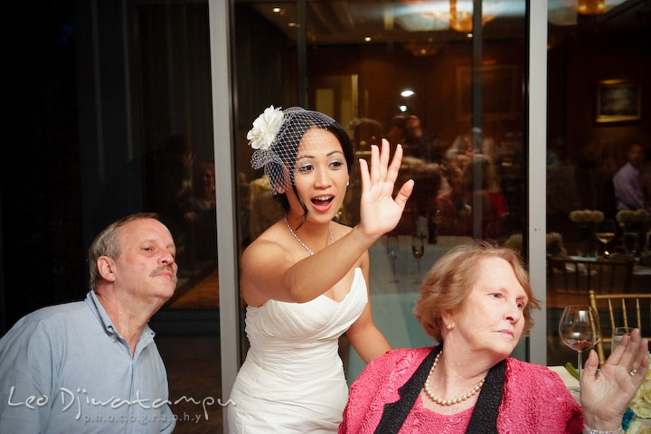 Bride and grandmother of groom waving at another guest. Falls Church Virginia 2941 Restaurant Wedding Photographer