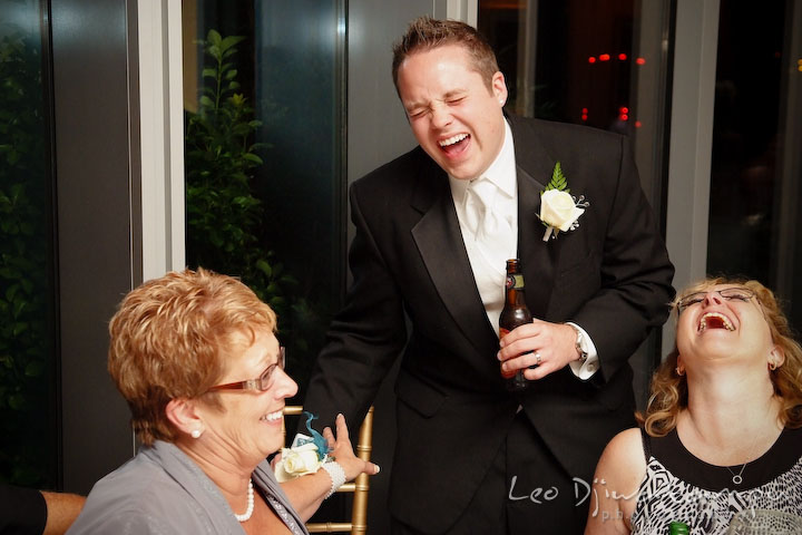 Groom, mother of groom and aunt laughing hard. Falls Church Virginia 2941 Restaurant Wedding Photographer