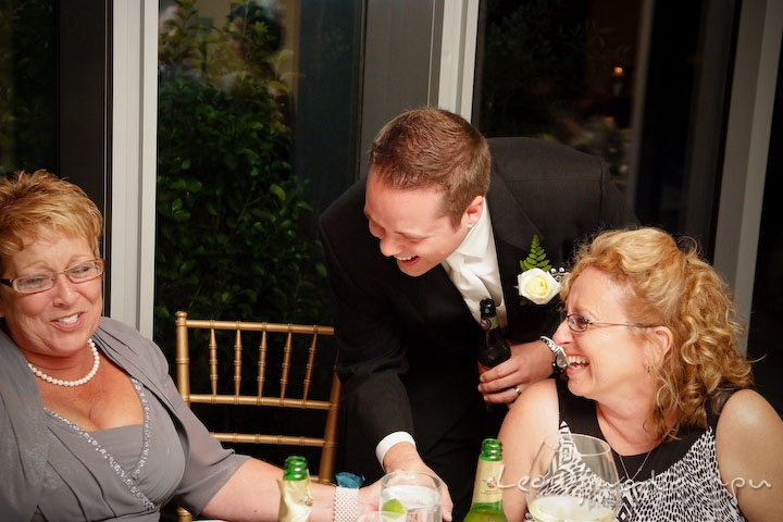 Mother of groom, groom and groom's aunt giggles. Falls Church Virginia 2941 Restaurant Wedding Photographer