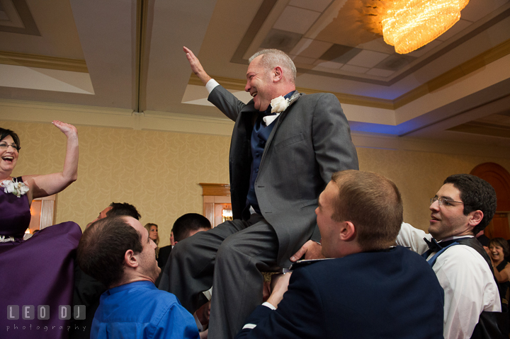 Mother and Father of Groom lifted up on chairs during hora dance. Marriott Washingtonian Center wedding at Gaithersburg Maryland, by wedding photographers of Leo Dj Photography. http://leodjphoto.com