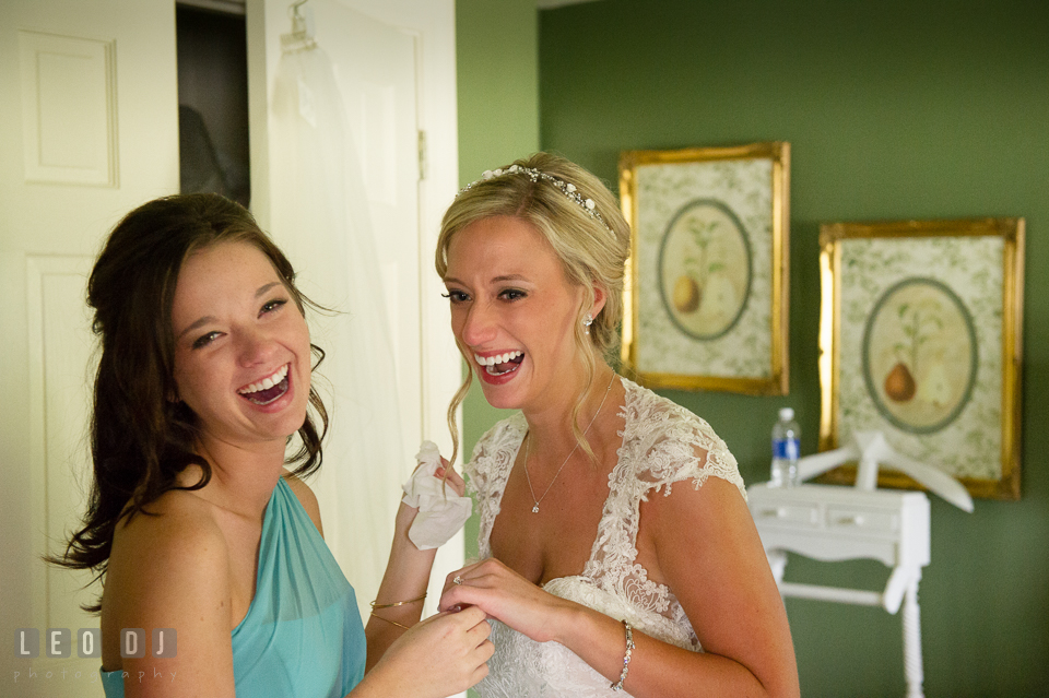 The Oaks Waterfront Inn Bride and Maid of Honor laughing together photo by Leo Dj Photography