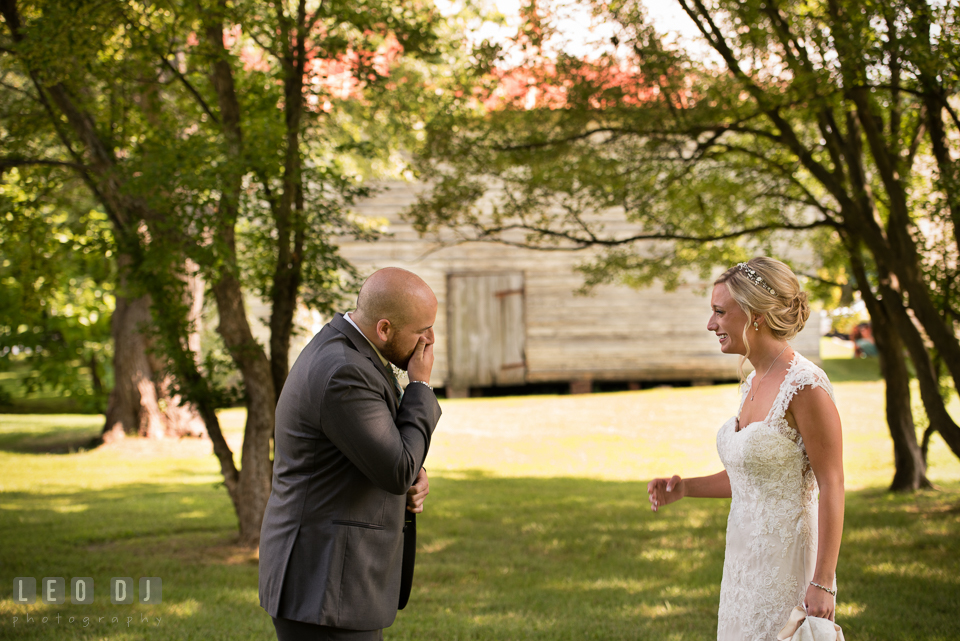 The Oaks Waterfront Inn Groom in awe seeing Bride the first time in her wedding dress photo by Leo Dj Photography