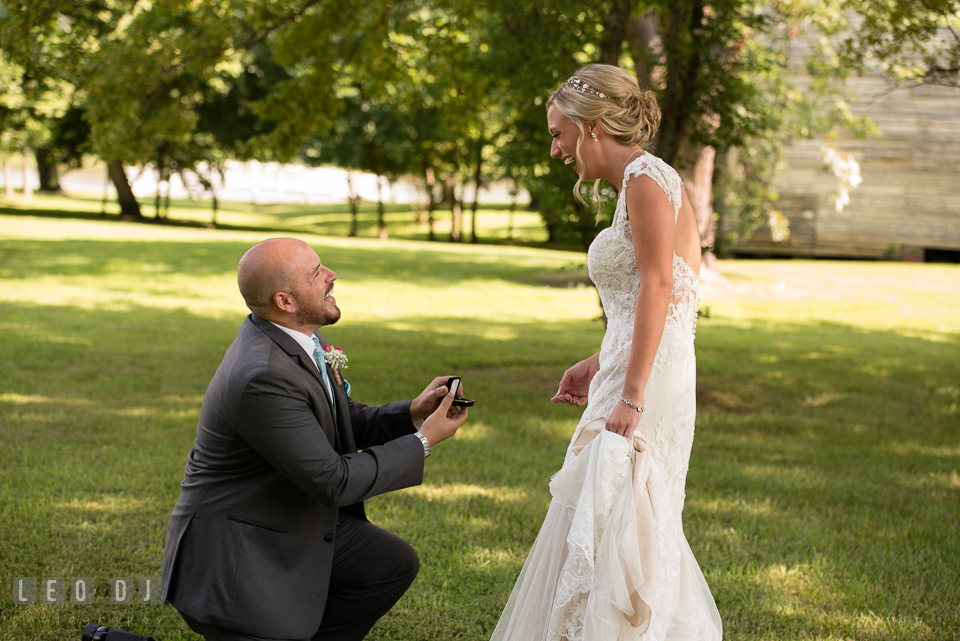 The Oaks Waterfront Inn Groom knelt in front of Bride proposing with earrings photo by Leo Dj Photography