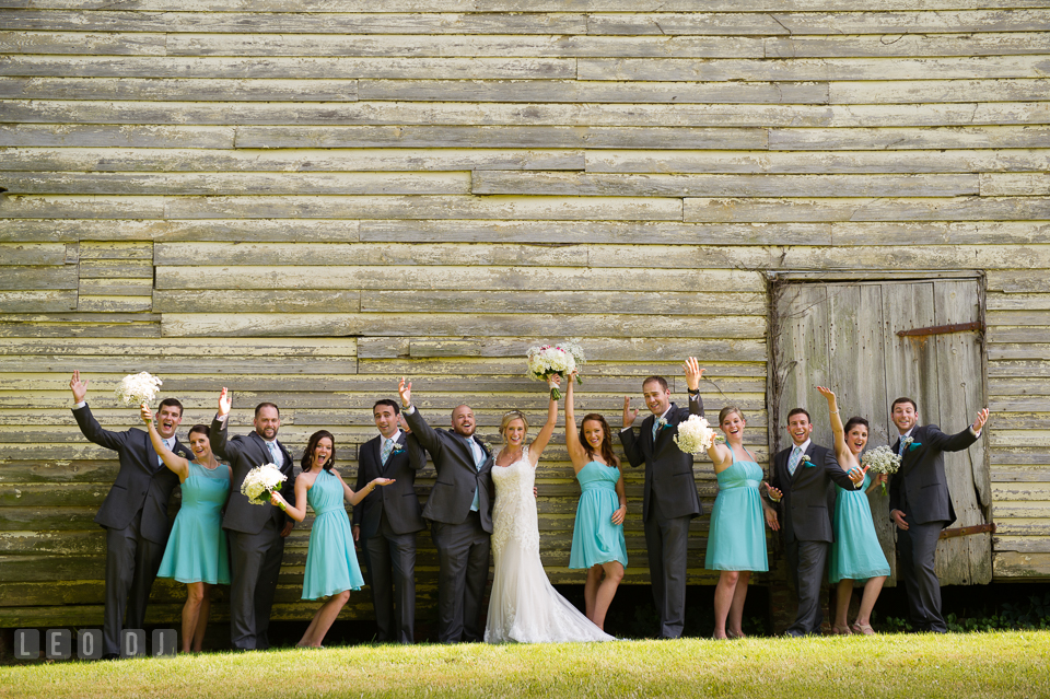 The Oaks Waterfront Inn Bride, Groom and the whole wedding party doing the happy pose photo by Leo Dj Photography