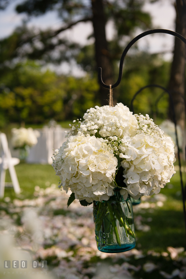 The Oaks Waterfront Inn white hydrangea floral decorations at the ceremony aisle by florist Seasonal Flowers photo by Leo Dj Photography