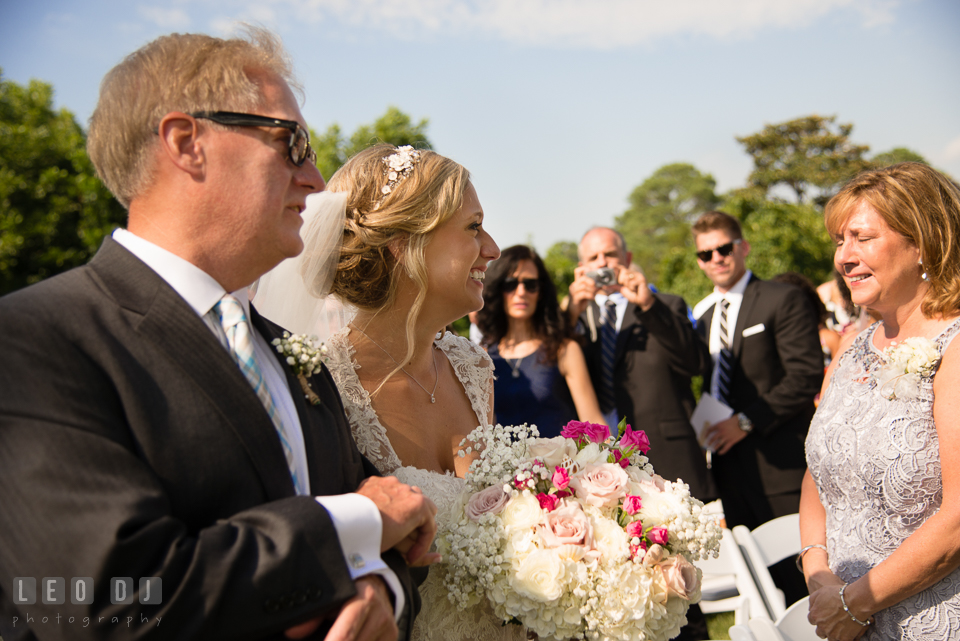 The Oaks Waterfront Inn Mother of Bride crying seeing daughter walking down the aisle during ceremony photo by Leo Dj Photography