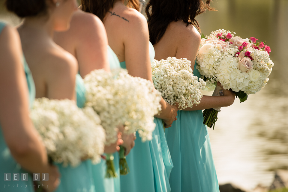 The Oaks Waterfront Inn Bridesmaids and Maid of Honor holding floral bouquets by florist Seasonal Flowers photo by Leo Dj Photography