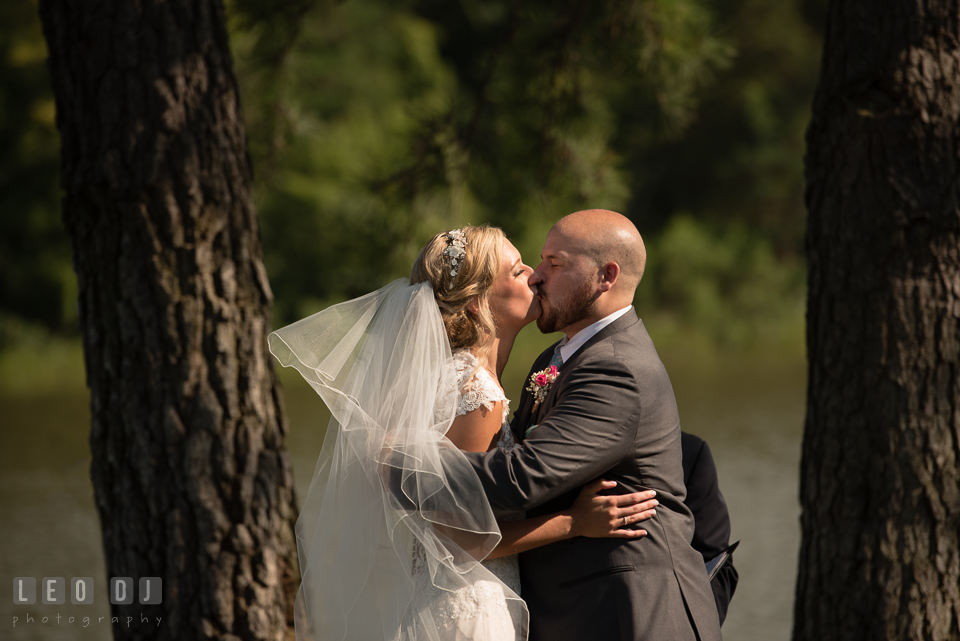 The Oaks Waterfront Inn Bride and Groom first kiss photo by Leo Dj Photography