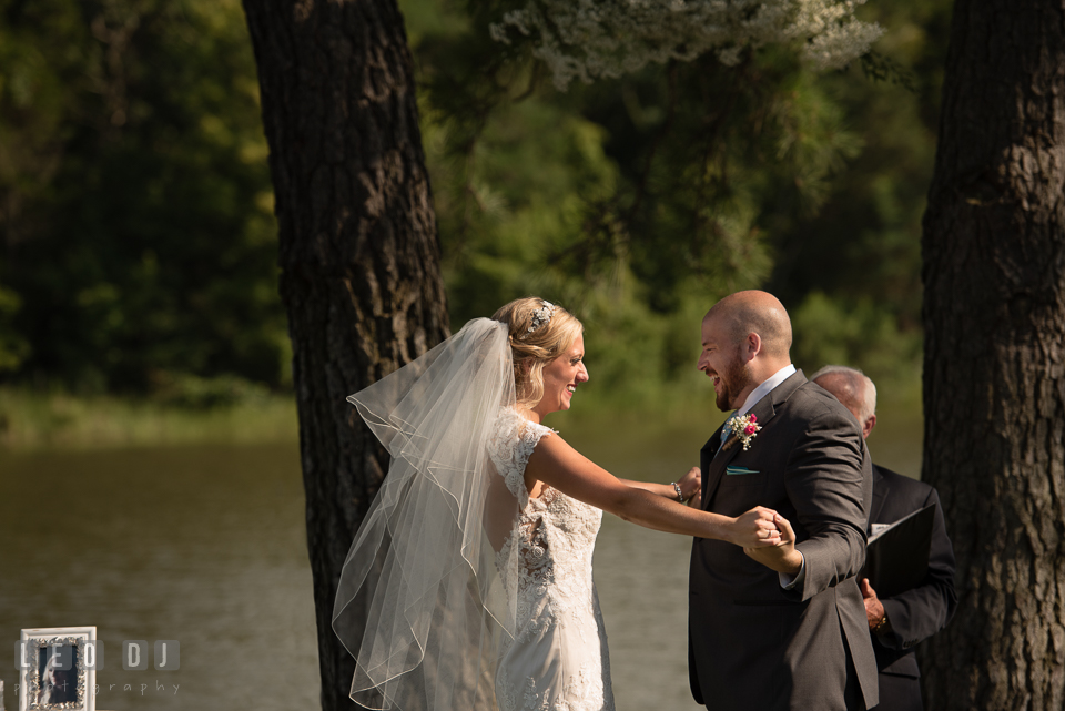 The Oaks Waterfront Inn Bride and Groom in joy after first kiss photo by Leo Dj Photography