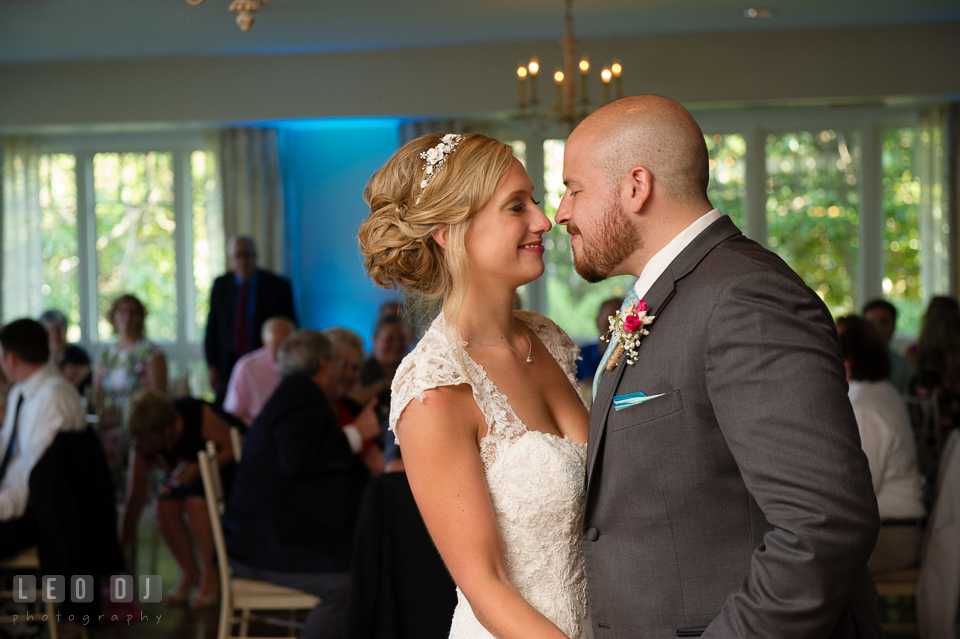 The Oaks Waterfront Inn Bride and Groom smiling together during first dance photo by Leo Dj Photography