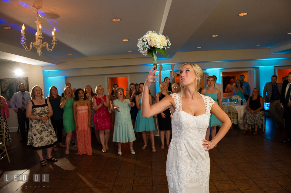 The Oaks Waterfront Inn Bride toss bouquet to the single ladies guests photo by Leo Dj Photography