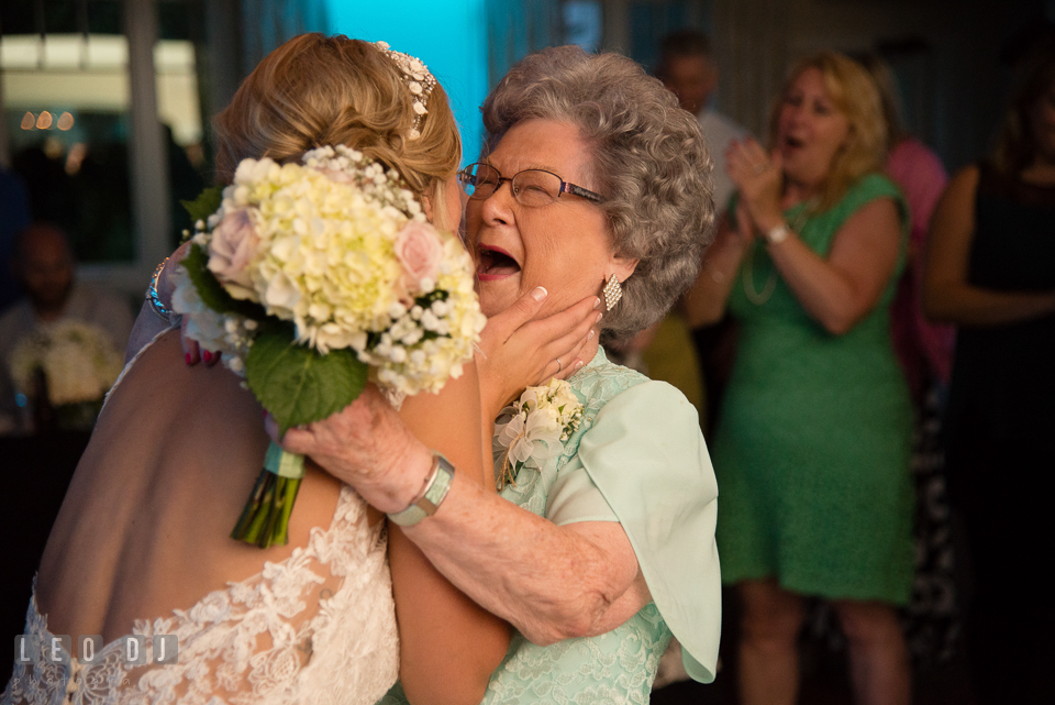 The Oaks Waterfront Inn Bride hugging Grandmother who caught the tossed flower bouquet photo by Leo Dj Photography