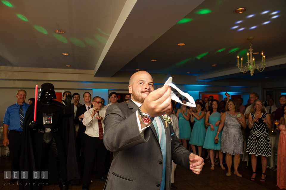 The Oaks Waterfront Inn Groom almost tossing garter to single men and Darth Vader photo by Leo Dj Photography