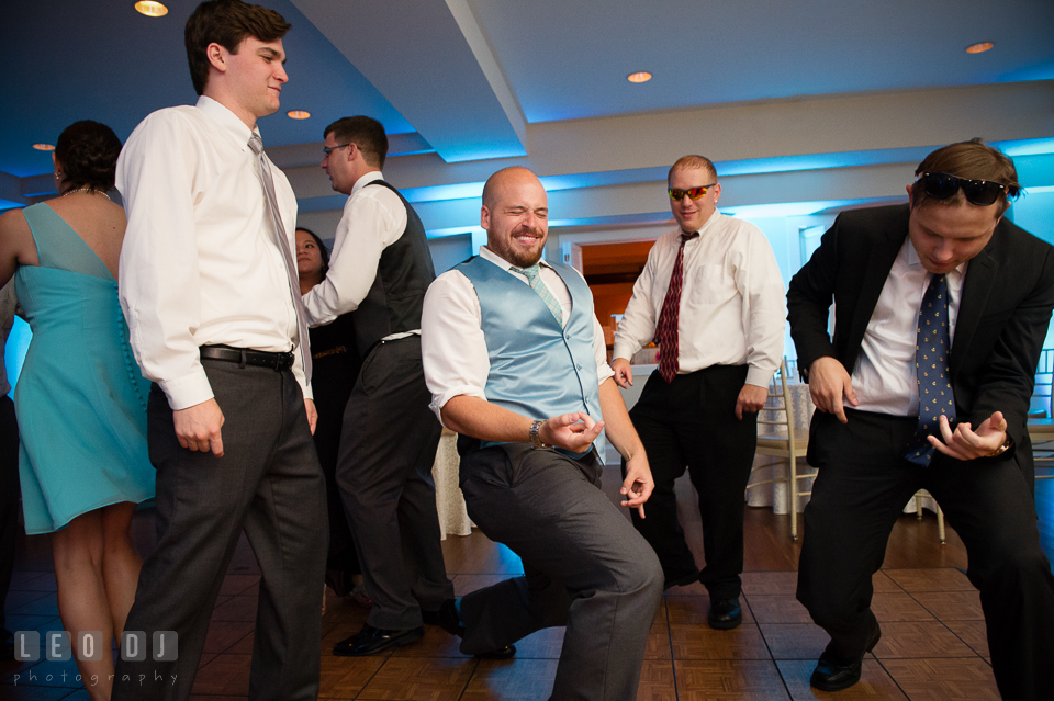 The Oaks Waterfront Inn Groom pretending to play guitar to the song Don't Stop Believin' from Journey photo by Leo Dj Photography