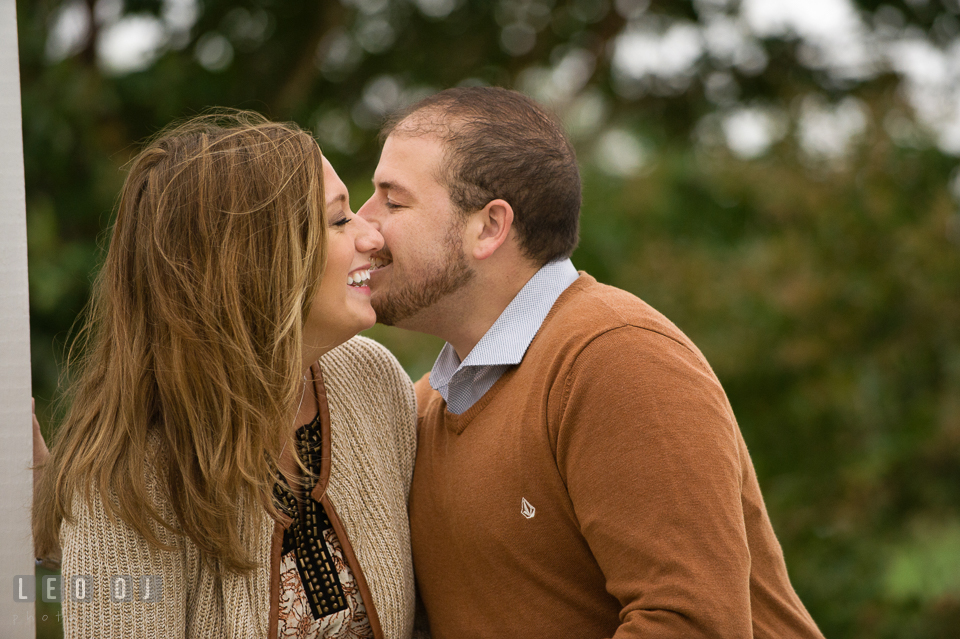 Engaged couple embracing each other and laughing. Eastern Shore Maryland pre-wedding engagement photo session at St Michaels MD, by wedding photographers of Leo Dj Photography. http://leodjphoto.com