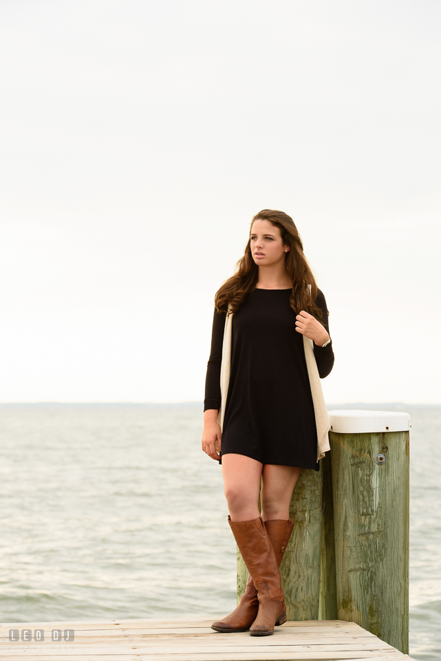 McDonogh High School Maryland senior beautiful girl leaning by a boat dock posts photo by Leo Dj Photography.