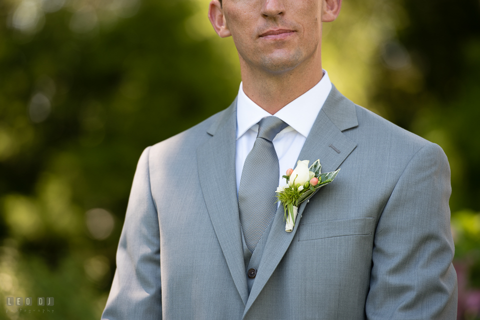 Kent Manor Inn groom with white rose boutonniere from florist Seaberry Farm photo by Leo Dj Photography