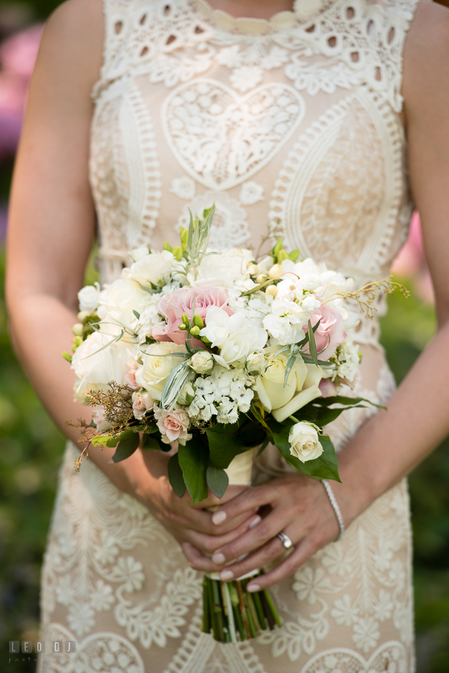 Kent Manor Inn bride holding beautiful pastel bouquet with roses by florist Seaberry Farm photo by Leo Dj Photography