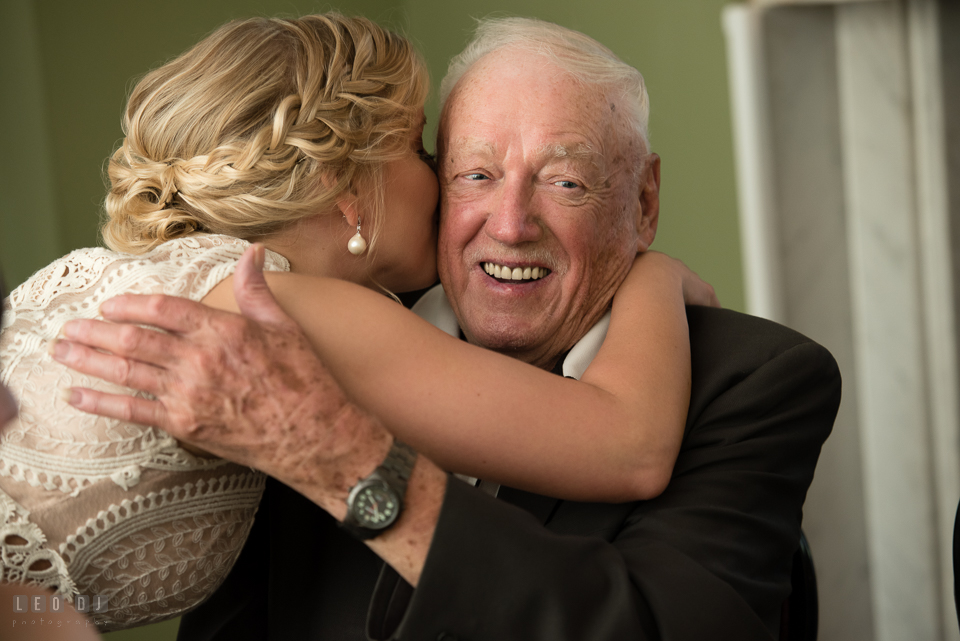 Kent Island Maryland bride hugged and kissed grandfather during wedding reception photo by Leo Dj Photography