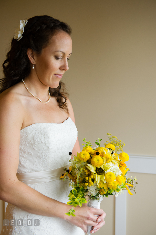 The Bride holding her lovely flower wedding bouquet by florist Willow Oak Flower and Herb Garden. Kent Island Maryland Chesapeake Bay Beach Club wedding photo, by wedding photographers of Leo Dj Photography. http://leodjphoto.com