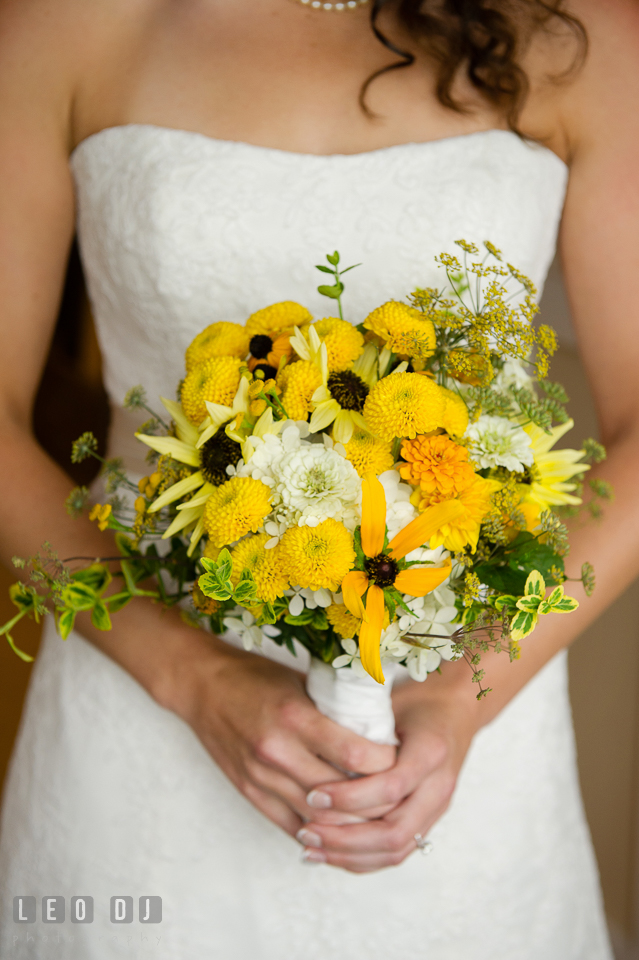 Bride and her floral bridal bouquet florist Willow Oak Flower and Herb Garden. Kent Island Maryland Chesapeake Bay Beach Club wedding photo, by wedding photographers of Leo Dj Photography. http://leodjphoto.com