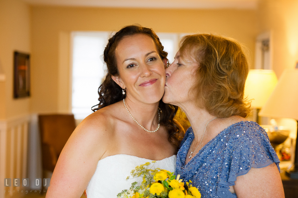 Mother kiss Bride's cheek. Kent Island Maryland Chesapeake Bay Beach Club wedding photo, by wedding photographers of Leo Dj Photography. http://leodjphoto.com