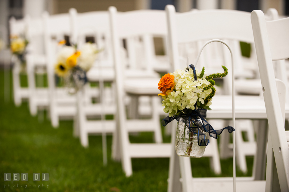 Stunning blooms adorned the aisle by florist Willow Oak Flower and Herb Garden. Kent Island Maryland Chesapeake Bay Beach Club wedding photo, by wedding photographers of Leo Dj Photography. http://leodjphoto.com